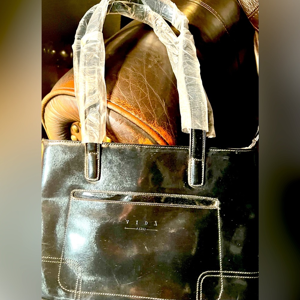 Brand new Gorgeous Black Vida Paris Hard cover shoulder purse.